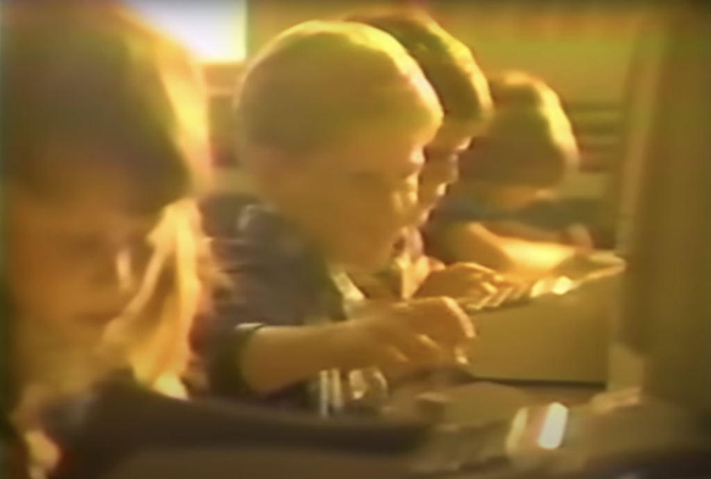 Apple advert from 80s showing boy teasing girl